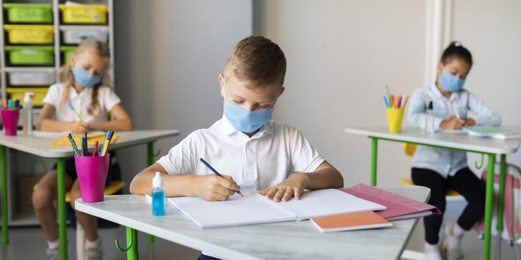 Kids in school with protection masks